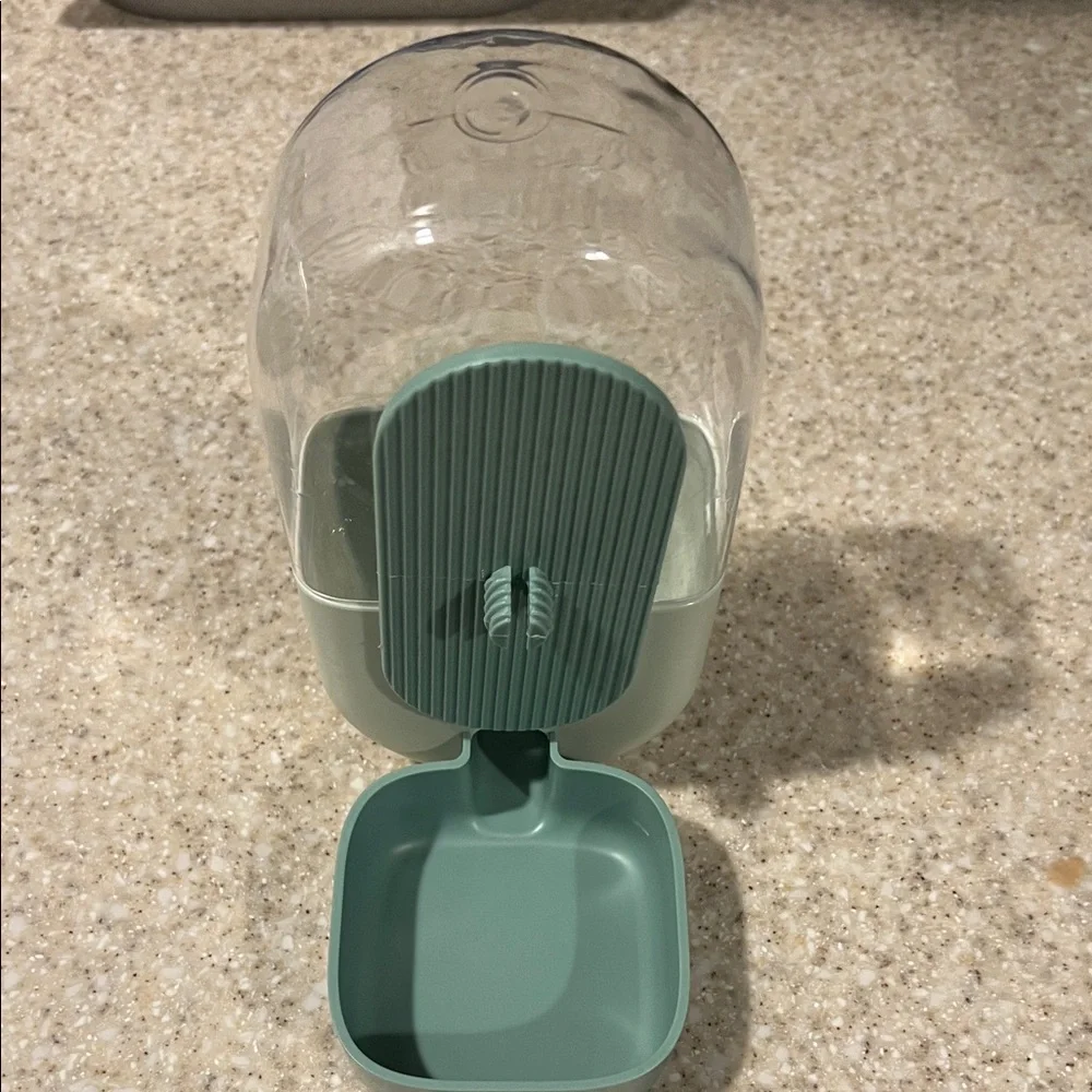 Clear and Green Parakeet Pet Food /Water Dispenser